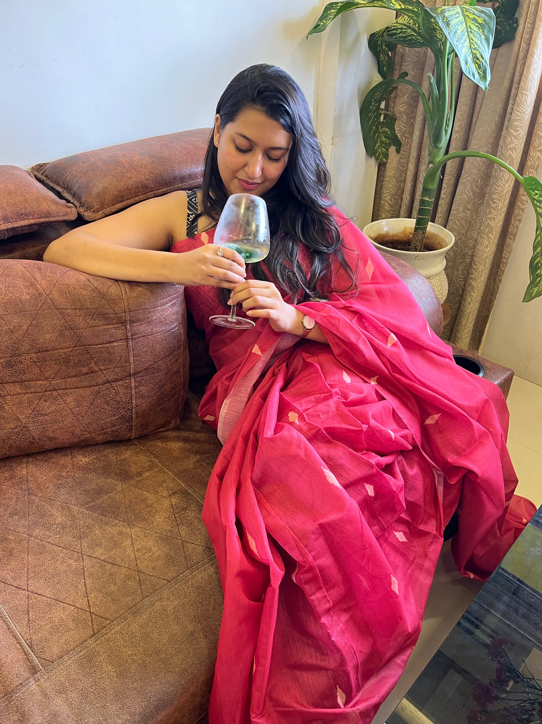 Woman confidently wearing a cotton or linen saree in natural light