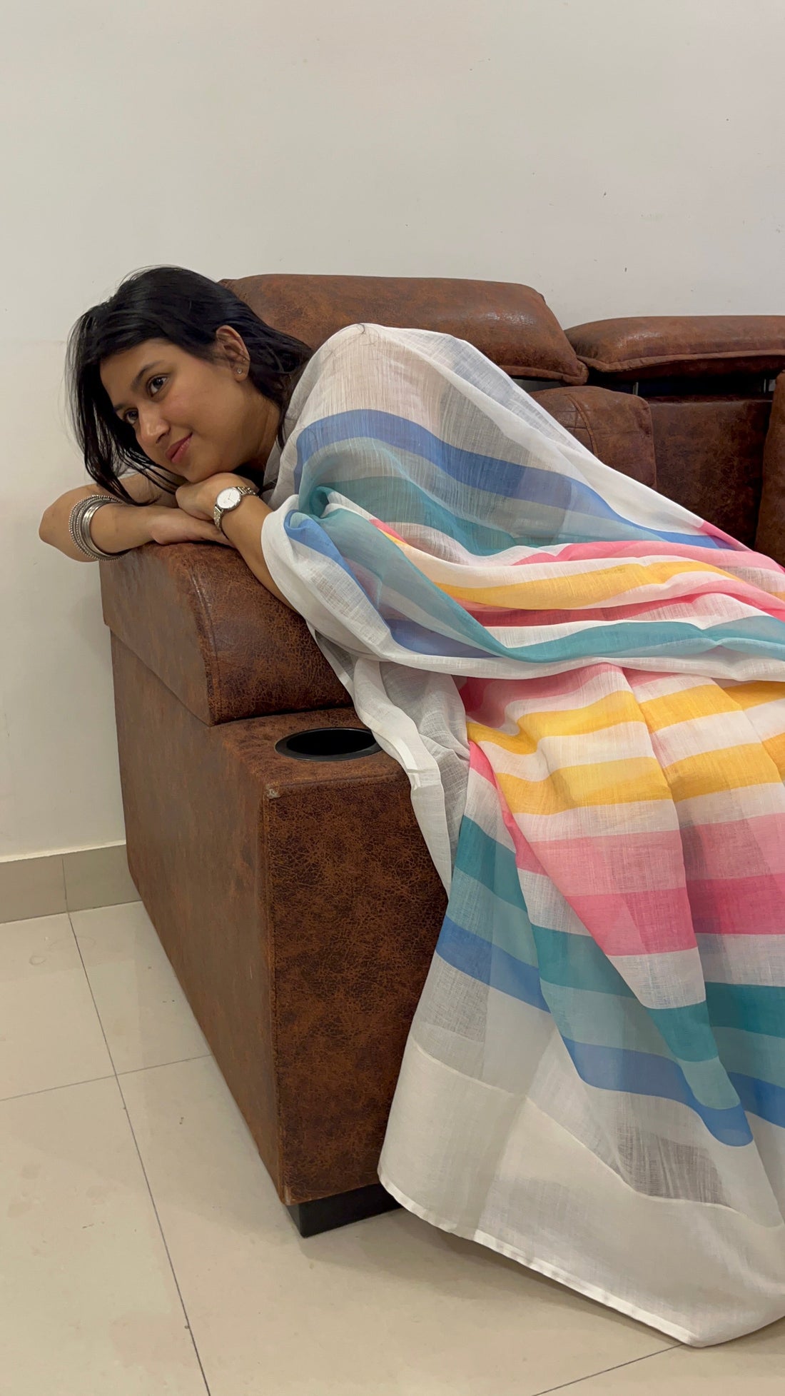 Linen saree pinned neatly at the shoulder