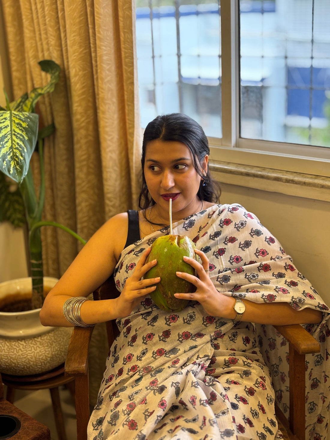 Woman wearing a breathable cotton saree in natural light
